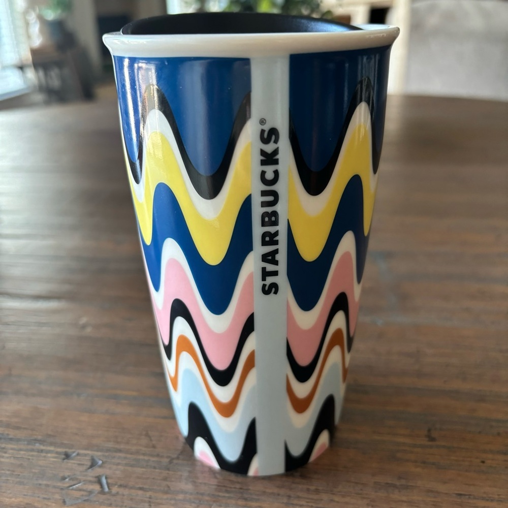 Starbucks 12 ounce ceramic travel cup with black lid